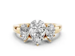 Pear Cut Diamond Three-Stone Ring Set in Yellow gold with Bold Center and Classic Band