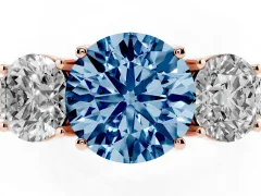 Fancy Blue Round Cut Diamond Three-Stone Engagement Ring Set in Rose gold with Milgrain Pavé Band