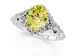 Fancy Yellow Oval Cut Diamond Solitaire Ring Set in Platinum with Hidden Halo and Pavé Band