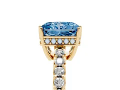 Fancy Blue Radiant Cut Diamond Solitaire Engagement Ring Set in Yellow gold with Pavé Band and Prong Setting