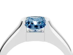 Fancy Blue Radiant Cut Diamond Bezel Solitaire Ring Set in White gold with Wide Band