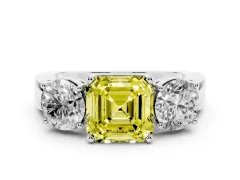 Fancy Yellow Asscher Cut Diamond Three-Stone Ring Set in White gold with Round Side Stones and Classic Band