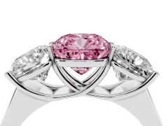 Fancy Pink Cushion Cut Diamond Three-Stone Ring Set in Platinum with Plain Polished Band