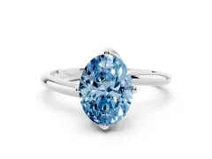 Fancy Blue Oval Cut Diamond Solitaire Engagement Ring Set in White gold with Classic Plain Band