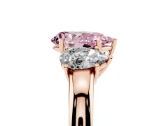 Fancy Pink Pear Cut Diamond Three-Stone Ring Set in Rose gold with Bold Center and Classic Band