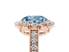 Fancy Blue Oval Cut Diamond Halo Pavé Engagement Ring Set in Rose gold with Milgrain Detailing