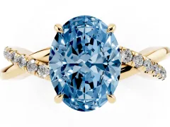 Fancy Blue Oval Cut Diamond Twisted Pavé Band Ring Set in Yellow gold with Prong Setting