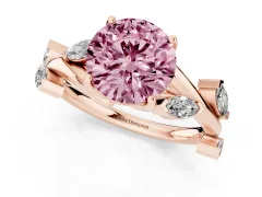 Fancy Pink Round Cut Diamond Solitaire Ring Set in Rose gold with Twisted Marquise Accent Band
