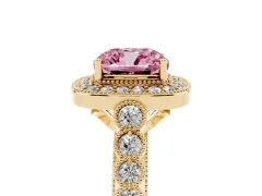 Fancy Pink Cushion Cut Diamond Milgrain Halo Solitaire Ring Set in Yellow gold with Bezel Set Side Stones and Pavé Band