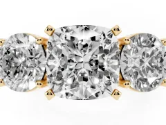 Cushion Cut Diamond Three-Stone Ring Set in Yellow gold with Round Side Stones and Classic Band