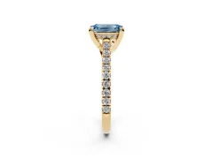 Fancy Blue Emerald Cut Diamond Solitaire Ring Set in Yellow gold with Brilliant Pavé Band and Prong Setting