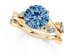 Fancy Blue Round Cut Diamond Solitaire Ring Set in Yellow gold with Twisted Marquise Accent Band