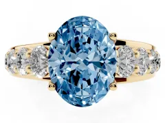Fancy Blue Oval Cut Diamond Pavé Engagement Ring Set in Yellow gold with Prong Setting
