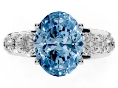 Fancy Blue Oval Cut Diamond Pavé Engagement Ring Set in Silver with Prong Setting
