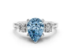 Fancy Blue Pear Cut Diamond Three-Stone Ring Set in Silver with Pavé Band and Smaller Side Stones