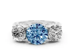 Fancy Blue Round Cut Diamond Three-Stone Ring Set in Silver with Textured Band