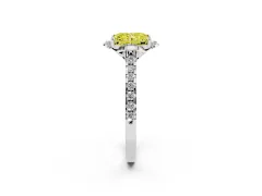 Fancy Yellow Radiant Cut Diamond Solitaire Ring Set in Platinum with Pavé Band and Floral Prong Setting