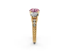 Fancy Pink Round Cut Diamond Three-Stone Engagement Ring Set in Yellow gold with Milgrain Pavé Band