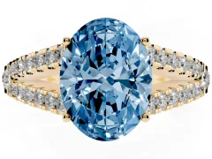 Fancy Blue Oval Cut Diamond Split Shank Pavé Engagement Ring Set in Yellow gold with Prong-Held Center Stone