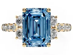 Fancy Blue Emerald Cut Diamond Three-Stone Pavé Ring Set in Yellow gold with Prong Setting