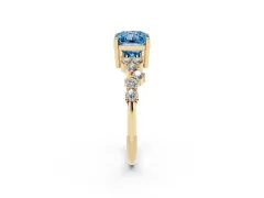 Fancy Blue Radiant Cut Diamond Ring Set in Yellow gold with Scattered Round Accents
