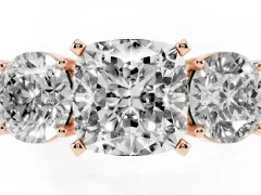 Cushion Cut Diamond Three-Stone Ring Set in Rose gold with Round Side Stones and Classic Band