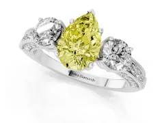 Fancy Yellow Pear Cut Diamond Three-Stone Ring Set in White gold with Round Side Stones and Pavé Band