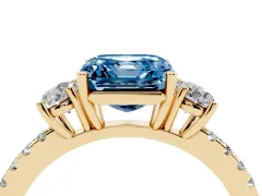 Fancy Blue Asscher Cut Diamond Three-Stone Ring Set in Yellow gold with Pavé Band and Graduated Sides