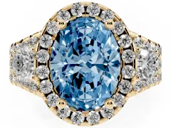 Fancy Blue Oval Cut Diamond Halo Split Shank Ring Set in Yellow gold with Round Accent Stones and Prong Setting