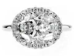 Oval Cut Diamond Halo Engagement Ring Set in White gold with Pavé Band and Rising Shoulders