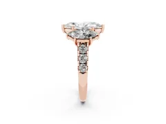 Marquise Cut Diamond Three-Stone Ring Set in Rose gold with Pavé Band