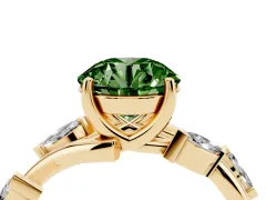 Fancy Green Round Cut Diamond Solitaire Ring Set in Yellow gold with Twisted Marquise Accent Band