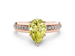 Fancy Yellow Pear Cut Diamond Solitaire Ring Set in Rose gold with Channel Set Band and Prong Setting