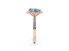 Fancy Blue Pear Cut Diamond Pavé Halo Engagement Ring Set in Rose gold with Pavé Band and Prong Setting