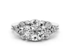 Round Cut Diamond Solitaire Ring Set in Silver with Cluster Accents on Each Side