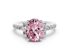 Fancy Pink Oval Cut Diamond Three-Stone Pavé Ring Set in White gold with Prong Setting