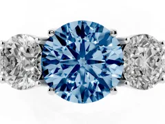 Fancy Blue Round Cut Diamond Three-Stone Engagement Ring Set in Platinum with Milgrain Pavé Band