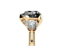 Fancy Black Heart Cut Diamond Three-Stone Ring Set in Yellow gold with Pavé Band and Smaller Side Stones