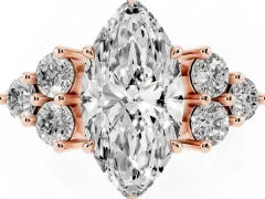Marquise Cut Diamond Solitaire Ring Set in Rose gold with Cluster Accents on Each Side