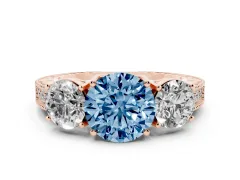 Fancy Blue Round Cut Diamond Three-Stone Engagement Ring Set in Rose gold with Milgrain Pavé Band