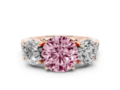Fancy Pink Round Cut Diamond Three-Stone Ring Set in Rose gold with Pavé Band