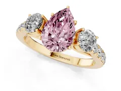 Fancy Pink Pear Cut Diamond Three-Stone Ring Set in Yellow gold with Round Side Stones and Delicate Pavé Band