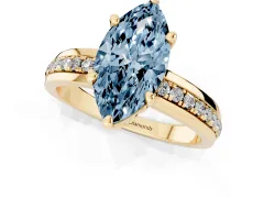 Fancy Blue Marquise Cut Diamond Solitaire Ring Set in Yellow gold with Channel Set Band and Prong Setting