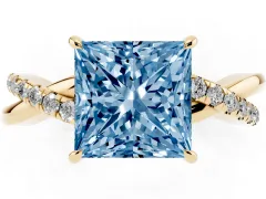 Fancy Blue Princess Cut Diamond Twisted Pavé Band Ring Set in Yellow gold with Prong Setting