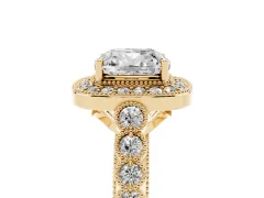 Cushion Cut Diamond Milgrain Halo Solitaire Ring Set in Yellow gold with Bezel Set Side Stones and Pavé Band