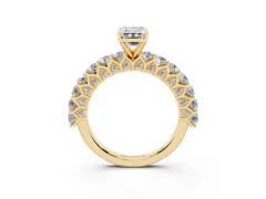 Emerald Cut Diamond Solitaire Ring Set in Yellow gold with Shared Prong Pavé Band