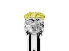 Fancy Yellow Cushion Cut Diamond Three-Stone Ring Set in Platinum with Plain Polished Band