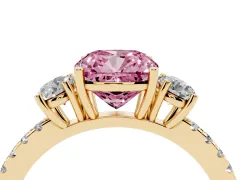 Fancy Pink Cushion Cut Diamond Three-Stone Ring Set in Yellow gold with Pavé Band and Graduated Sides