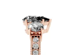 Fancy Black Pear Cut Diamond Three-Stone Ring Set in Rose gold with Round Side Stones and Pavé Band