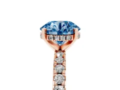 Fancy Blue Round Cut Diamond Pavé Solitaire Ring Set in Rose gold with Round Band Accents and Prong Setting